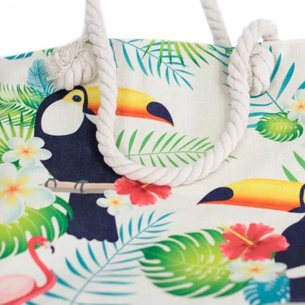 Cream canvas tropical tote bag featuring a colourful toucan print and knotted rope handles.