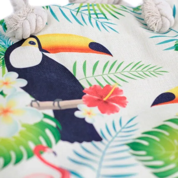 Cream woven canvas tropical tote bag featuring a colourful toucan print and rope handles.