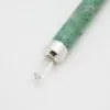 Crystal Point Quartz Gemstone Green And Purple Silver Band Speckled green and purple quartz crystal point with a silver band and clear quartz.