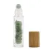 Green quartz crystal glass roller bottle with a natural bamboo lid.
