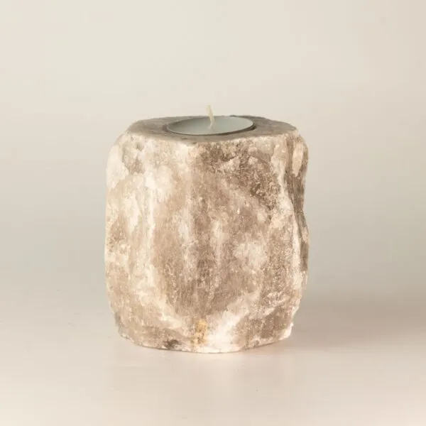 Tealight Candle Holder Himalayan Salt Grey Rough Block Lit candle inside a rough grey Himalayan rock salt tealight holder.