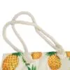 Off-white canvas tote bag featuring a tropical pineapple print and knotted jute handles.