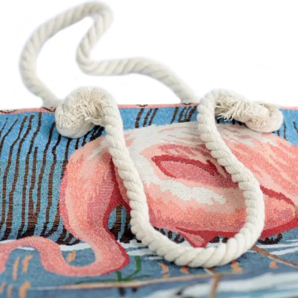 Light blue tapestry tote bag featuring a woven pink flamingo and white rope handles.