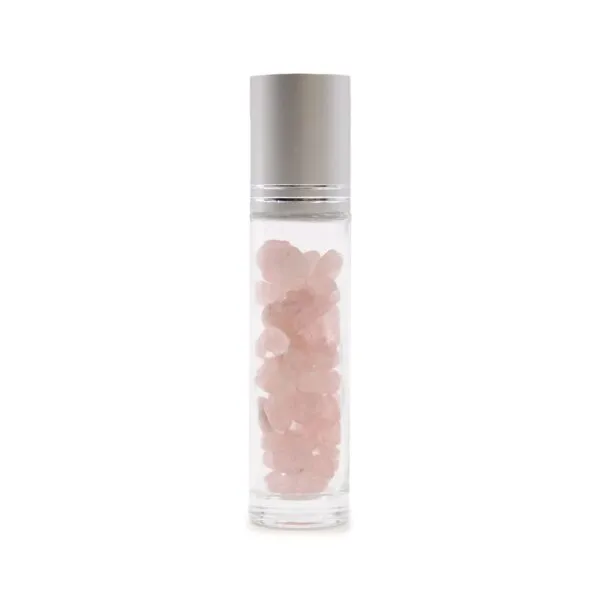 Clear glass roller bottle filled with pink rose quartz crystals and a silver cap.