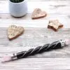 Magic Wand Rose Quartz Leather Pink Silver Gemstone Ring Pink rose quartz magic wand with a dark leather handle and silver gemstone accents.