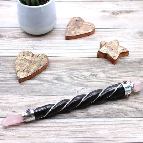 Magic Wand Rose Quartz Leather Pink Silver Gemstone Ring Pink rose quartz magic wand with a dark leather handle and silver gemstone accents.