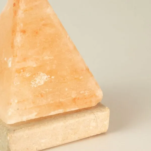 USB-powered natural Himalayan pink salt pyramid lamp on a marble base.