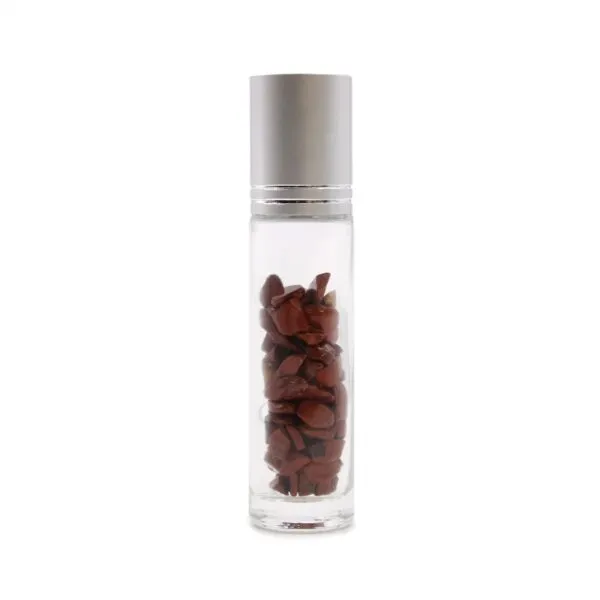 Clear glass rollerball bottle containing dark red jasper crystals with a brushed silver cap.