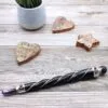 Twisted Magic Wand - Wooden Silver Wire Red Gemstone Twisted wooden magic wand wrapped with silver wire and featuring a red gemstone.