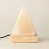 Pyramid Salt Lamp Natural Stone White USB Night Light Pyramid-shaped white natural stone USB salt lamp on a polished square base.