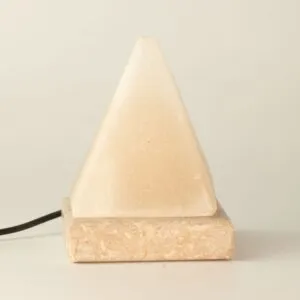 Pyramid-shaped white natural stone USB salt lamp on a polished square base.