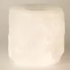 White cylindrical Himalayan rock salt tea light holder featuring a coarse, natural finish.
