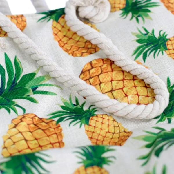 Yellow pineapple print canvas tote bag with a thick, off-white rope handle.