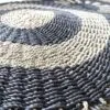 bG9jYWw6Ly9tZWRpYS85SC8wRS82MFIzMEMxRzZSVDMwRTlILzY2MTY5NmViLmpwZWc.webp Round Seagrass Black and Tan - Circles - 1m
