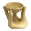 Essential Oil Warmer Ceramic Beige Cupped Hands Design Matte beige ceramic essential oil warmer designed as cupped hands holding a dish.