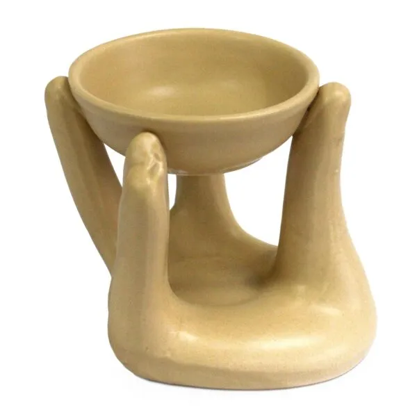 Essential Oil Warmer Ceramic Beige Cupped Hands Design Matte beige ceramic essential oil warmer designed as cupped hands holding a dish.