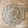 Round Braided Area Rug Jute and Denim Blue Spiral Pattern Handcrafted round braided jute and recycled denim area rug with a blue spiral pattern.