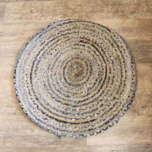 Round Braided Area Rug Jute and Denim Blue Spiral Pattern Handcrafted round braided jute and recycled denim area rug with a blue spiral pattern.