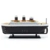 Black plastic Titanic ocean liner model light with warm backlit portholes and touch controls.