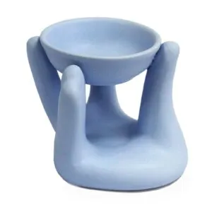 Hand-shaped matte ceramic tealight holder featuring a speckled blue and purple gradient.