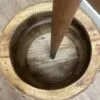 Butter Churn Barrel Wooden Brown Interior Dasher Pole Top-down view inside a vintage wooden butter churn barrel with a central dasher pole.