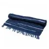 Striped Area Rug Woven Fabric Blue And White Fringed Edges Rolled blue and white striped woven area rug with fringed edges.