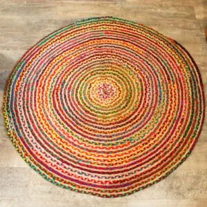 Round Rug Braided Yarn Red Multicoloured Spiral Pattern Round red braided yarn rug with a multicoloured spiral pattern on light wood floorboards.