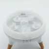 Essential Oil Diffuser Ultrasonic White - Wooden Legs Modern white ultrasonic essential oil diffuser featuring a clear reservoir and light wooden legs.