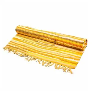 Handwoven yellow, gold and white striped cotton rug featuring fringe tassels.